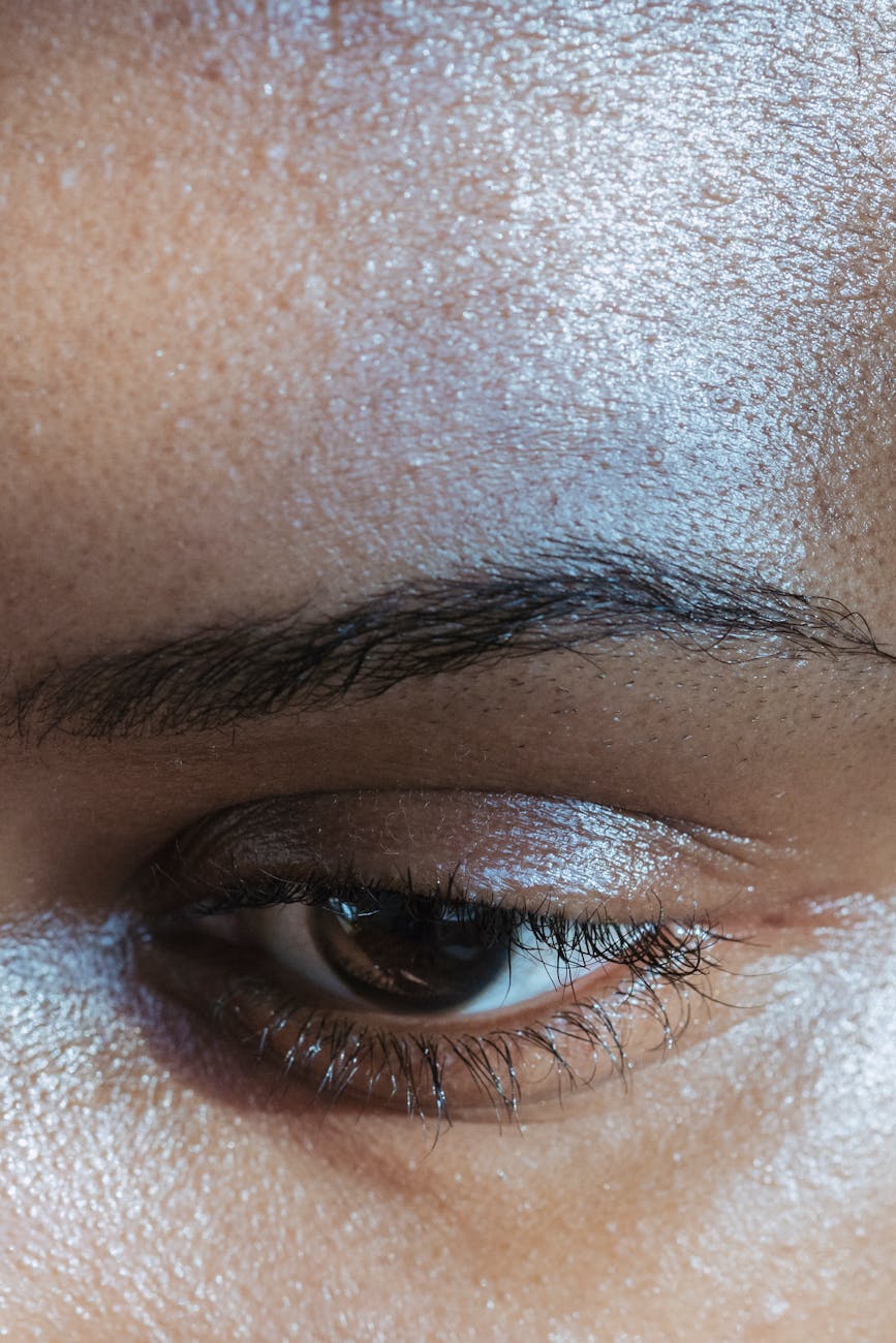 face of crop black woman with dark eyes